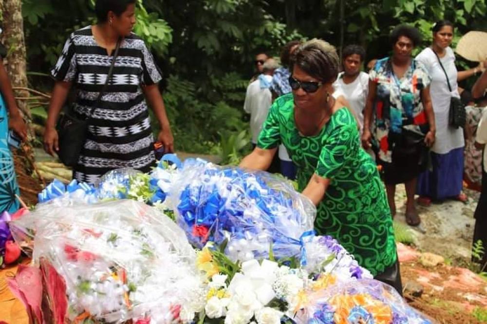 Katarina Mukai former Lay Missionary  places a wreath on the grave - Photo: Fr Donal McIlraith