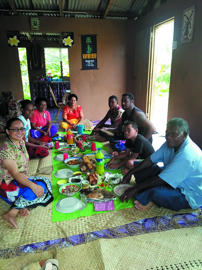 Columban Lay Missionary Evangeline Ucol (left) sharing a meal with  the people of Fiji. Photo: Evangeline Ucol