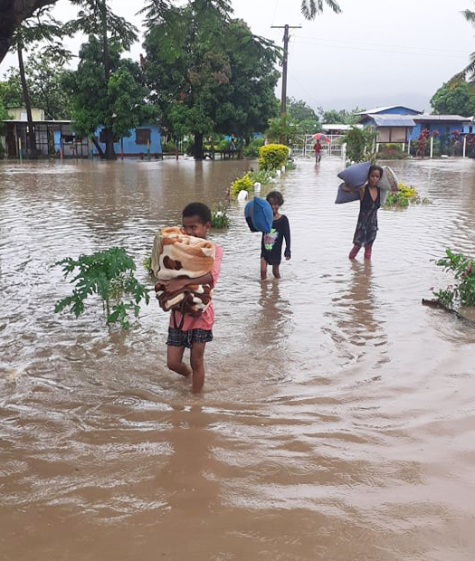 The children carrying their bedding to school - Photo: Gabby Naborisi Ramoce