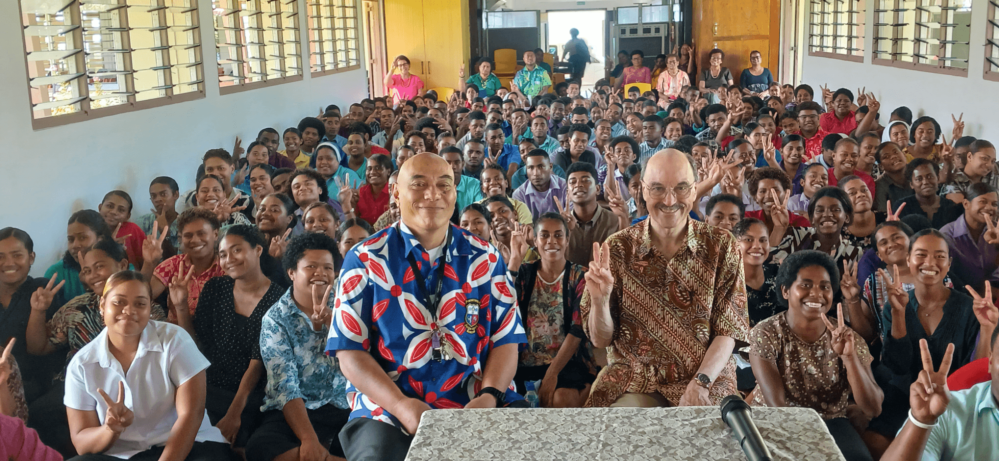 Leo Lefebure with students and teachers at Corpus Christi College. Photo: Pescila Magdalin