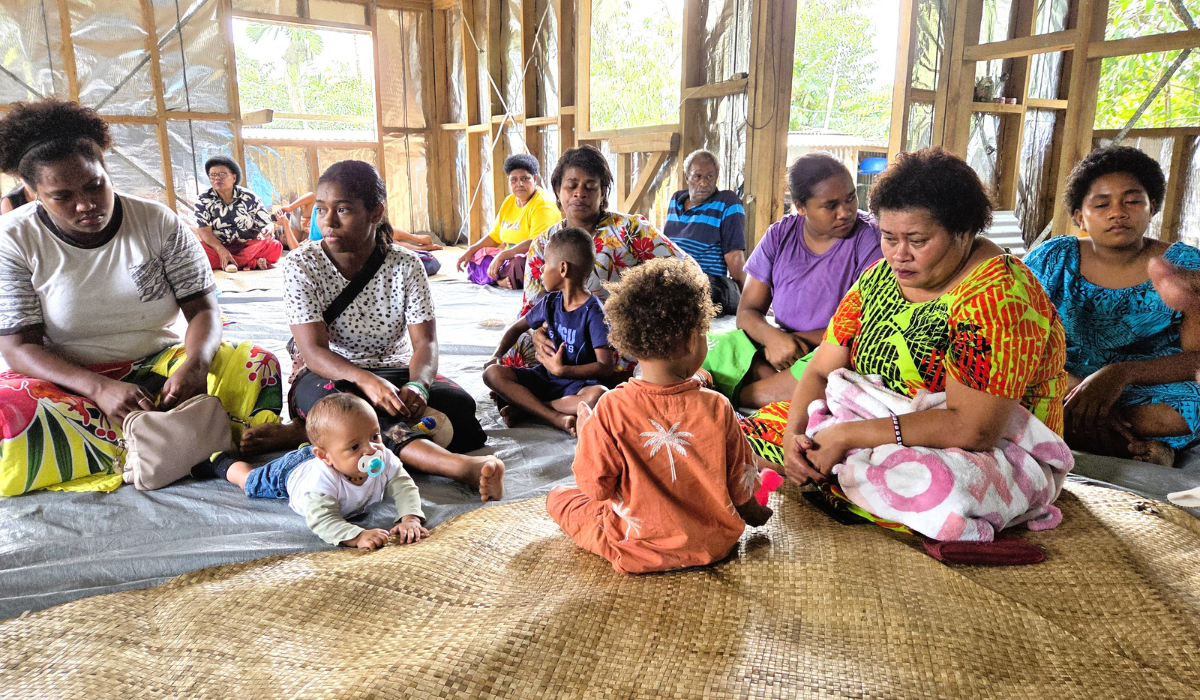 Families of the Nanuku Nine gather for a commemorative Mass, holding photos of their missing loved ones in prayer and hope. Photo: Fr Frank Hoare SSC