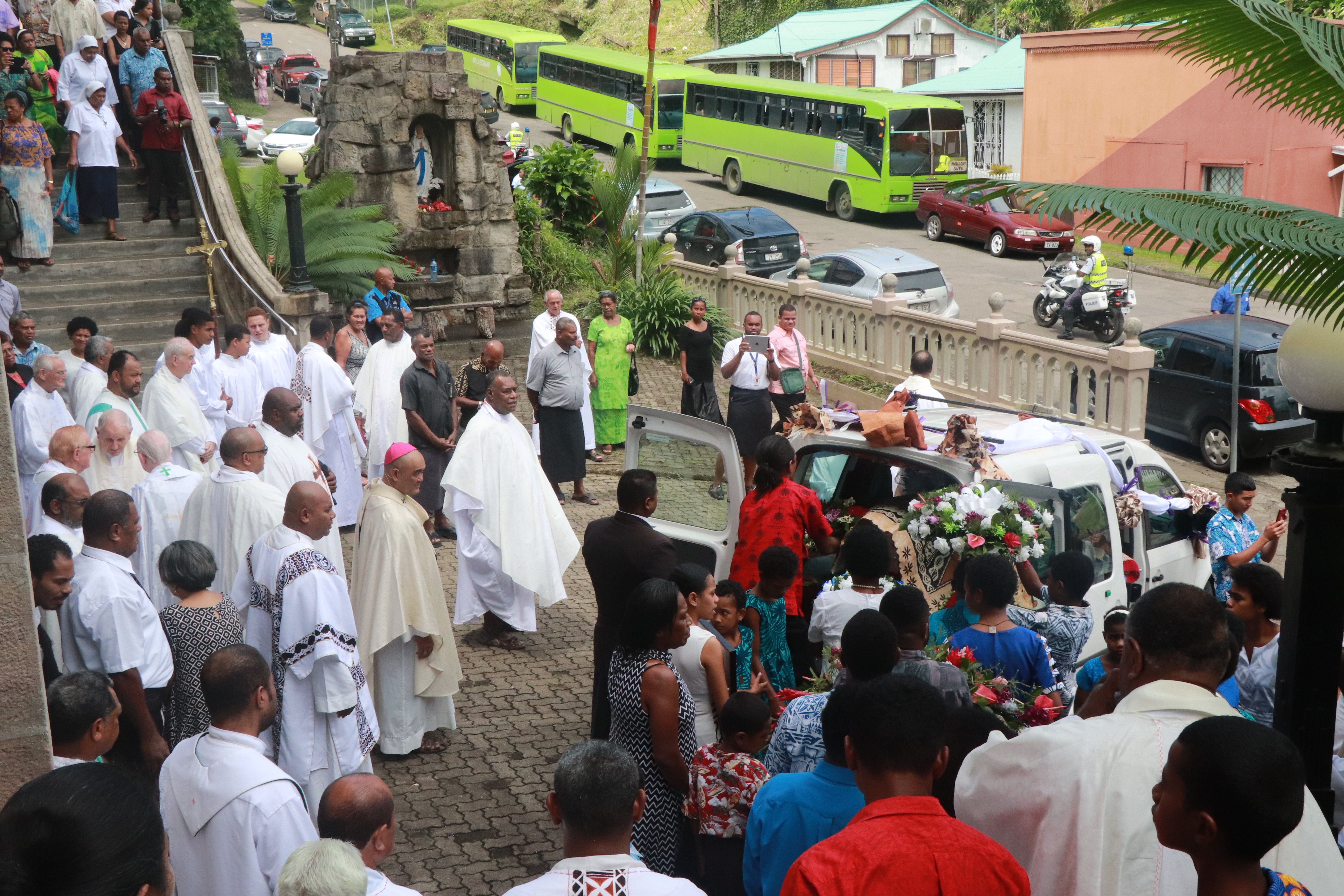 Fr Kevin Body laid in car ready to be taken to the cemetry